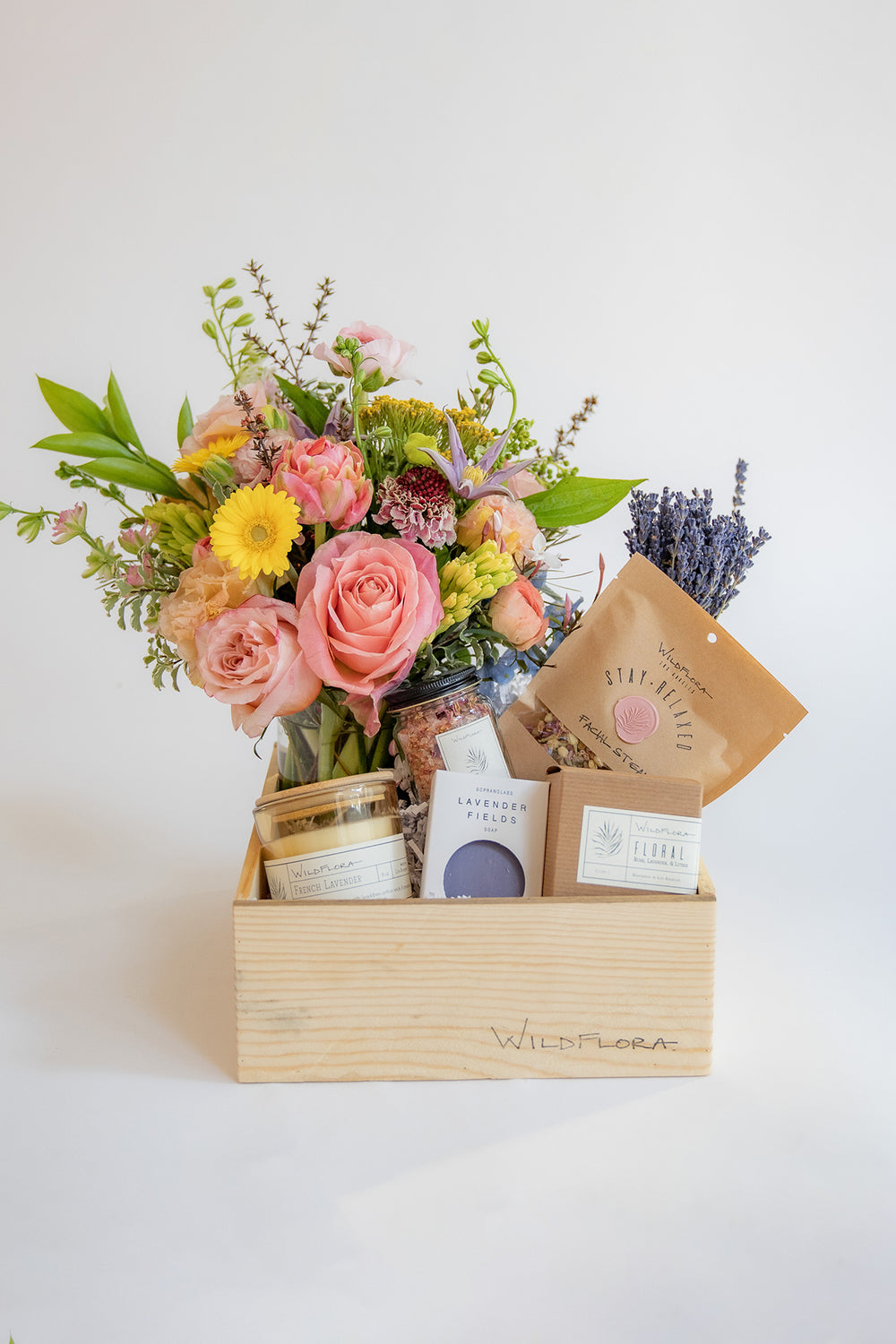 WildFlora Gift box Wellness within regular wood gift box with colorful fresh flowers, soap, candle, bath soak, bath salt, facial steam, and lavender bundle