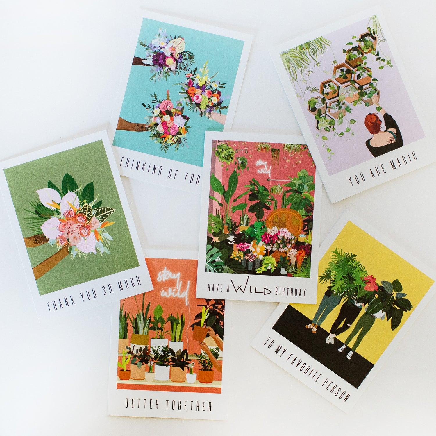 A flat lay of graphic greeting cards laying on a white background. They are colorful, punchy, and fun.
