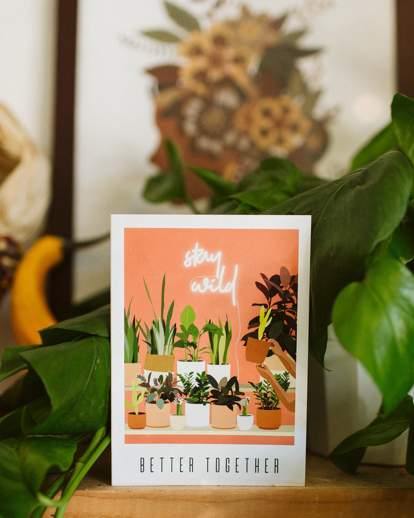 A greeting card that reads "better together". The artwork on it is of a shelf full of potted plants.