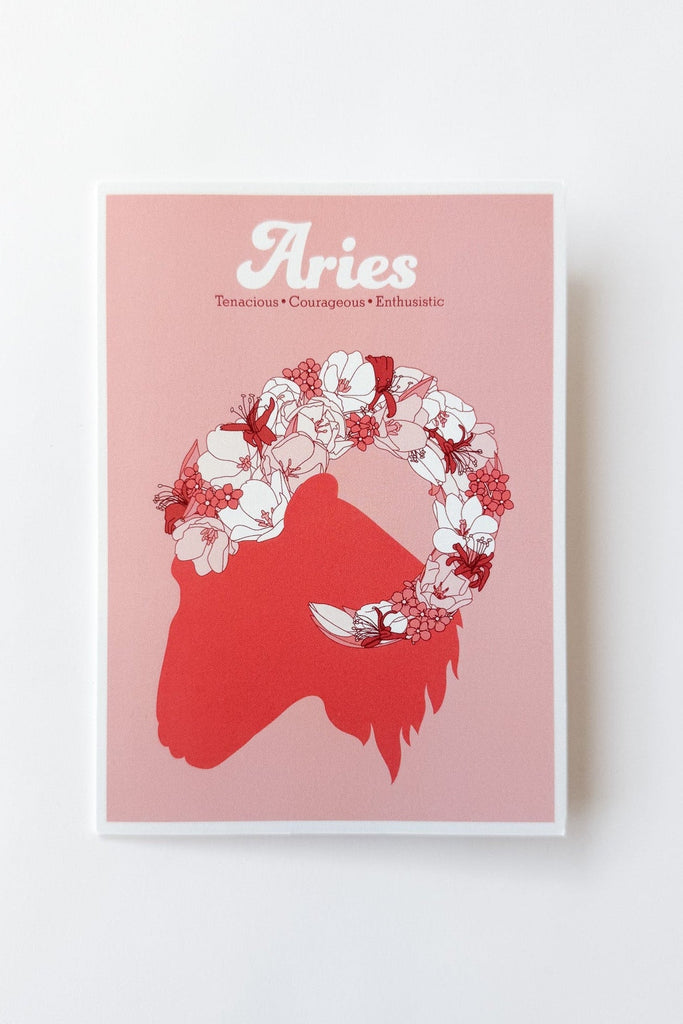 A greeting card featuring the Aries zodiac sign, with a red ram silhouette, white and red floral crown, and the word 'Aries' in white script on a muted red background, shown against a white background.