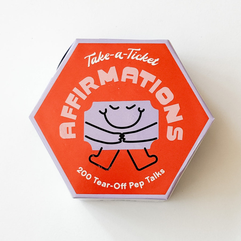 A hexagonal orange box of 'Take-a-Ticket AFFIRMATIONS' tear-off pep talks, featuring a cute smiling character drawing on a white background.