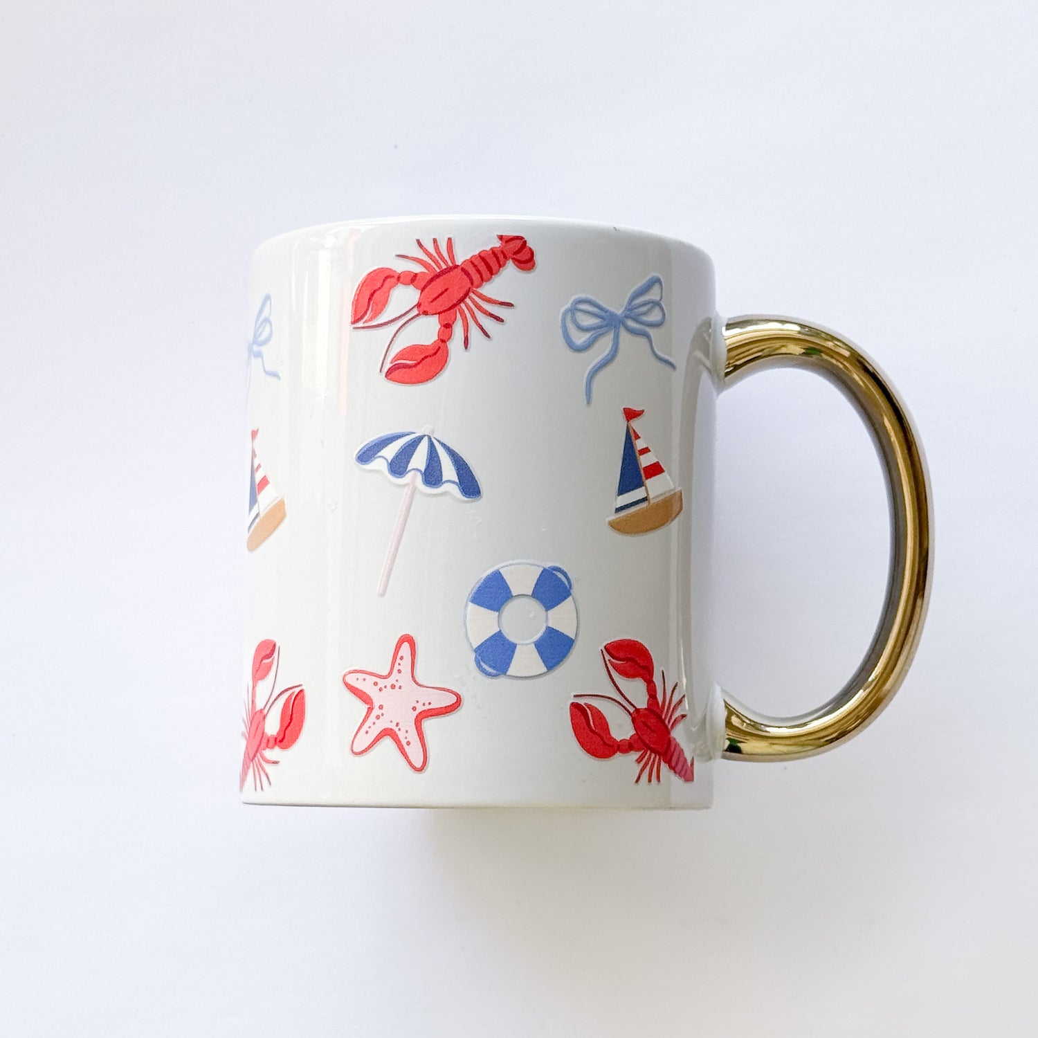 White mug with colorful nautical illustrations on a white background