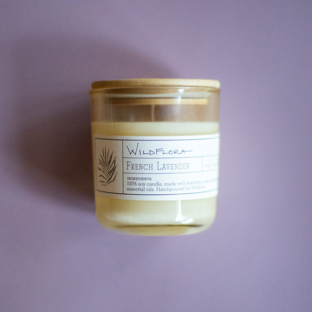 WildFlora French Lavender Candle jar  with wood lid on a purple background