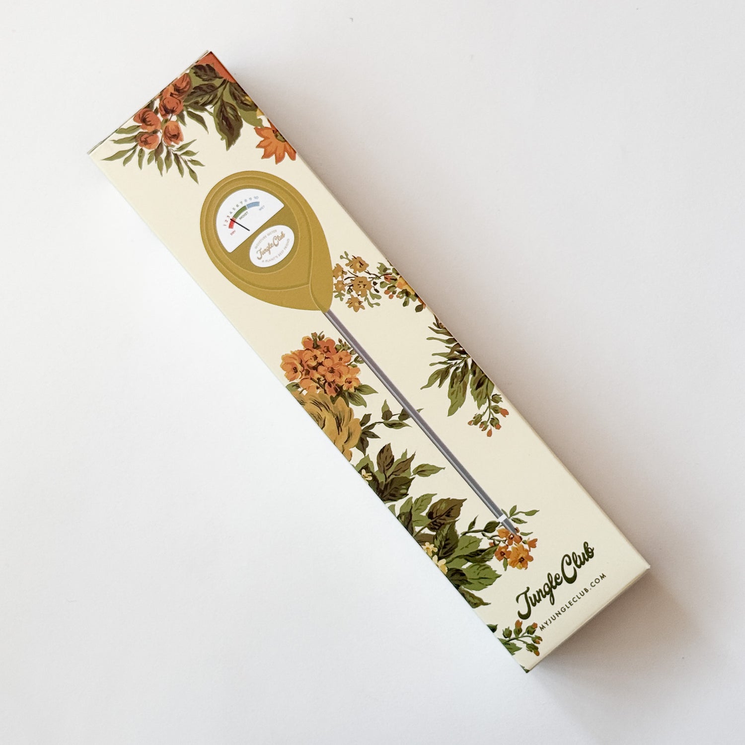A pea green plant moisture meter in its floral-patterned packaging, photographed on a clean white background.