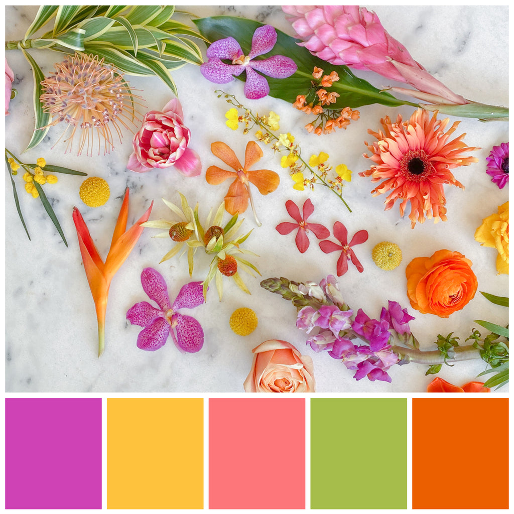 A flower palette option: a flatlay of tropical blooms on a marble background. The colors included are fuchsia, yellow, coral, pink, green, and orange.